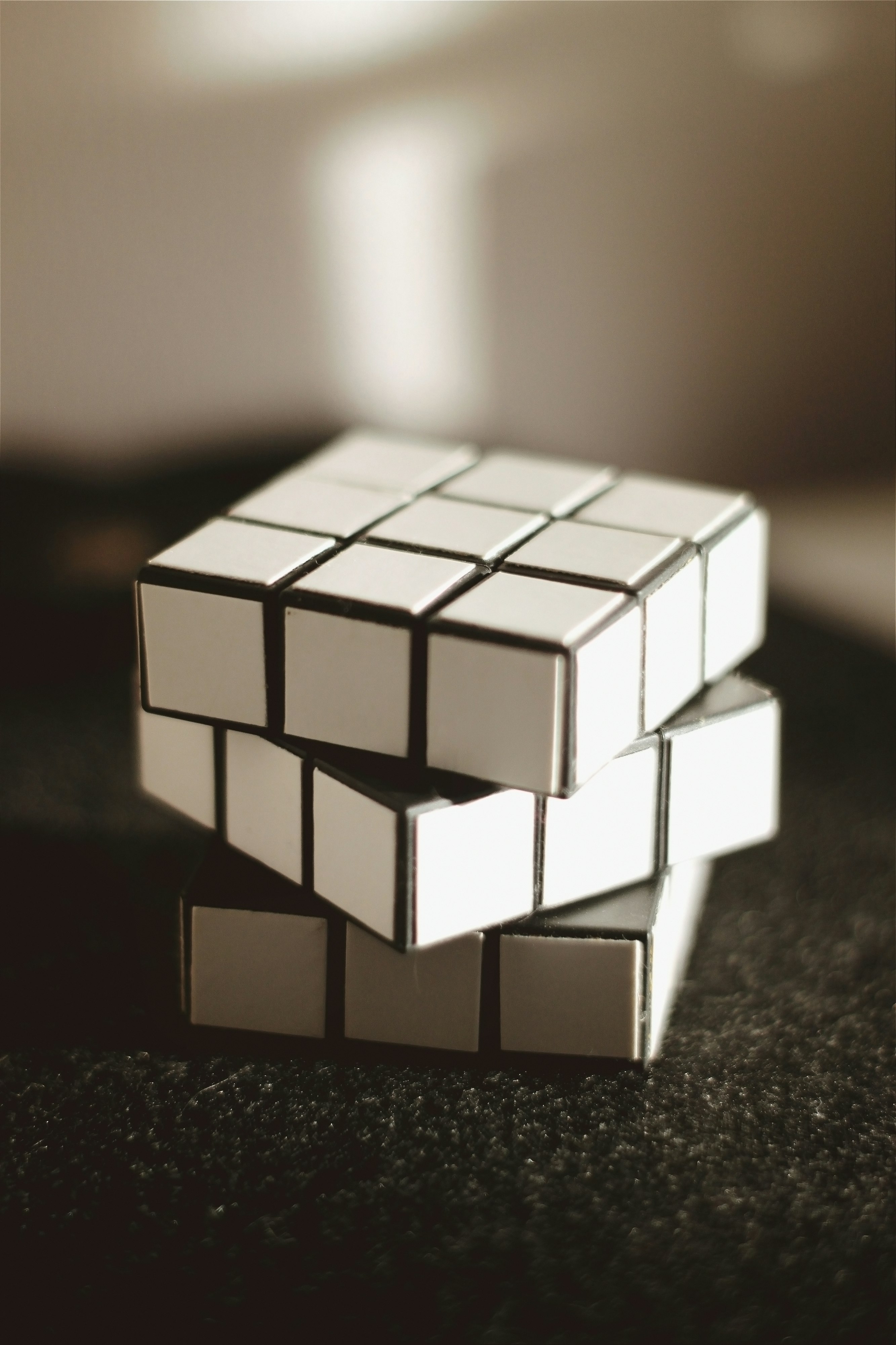 white and black 3 x 3 rubiks cube