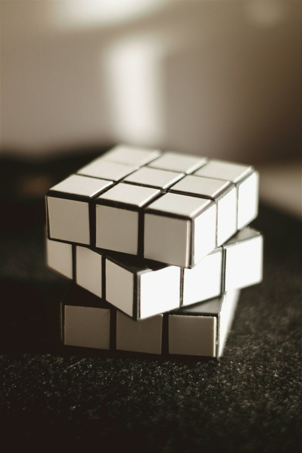 white and black 3 x 3 rubiks cube