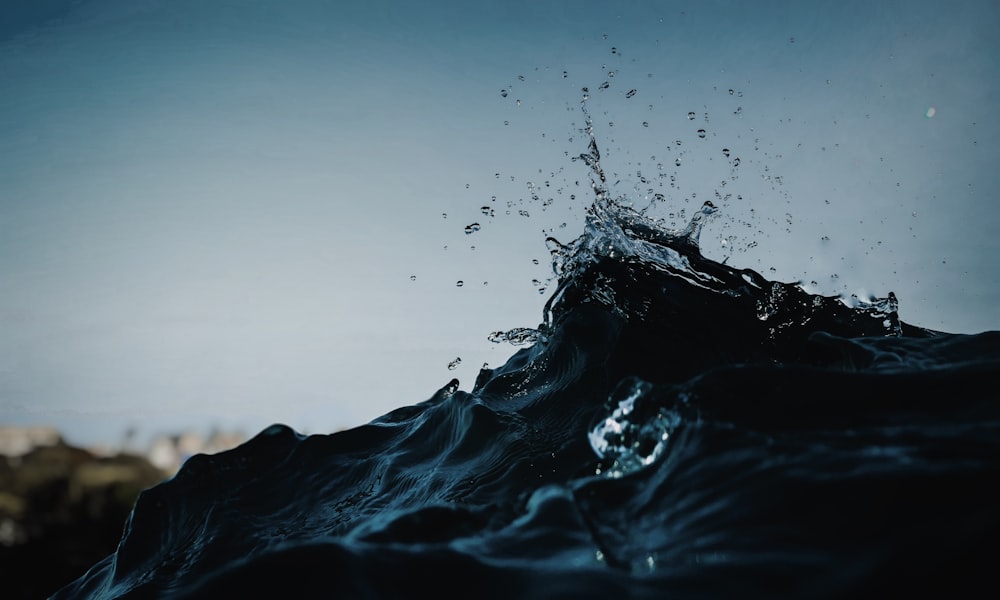 water splash on black rock