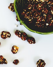 A vibrant spread of ethico eat's caramel popcorn in eco-friendly packaging on a wooden table