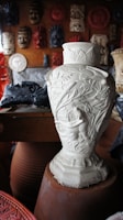white floral ceramic vase on brown wooden table