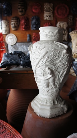 white floral ceramic vase on brown wooden table