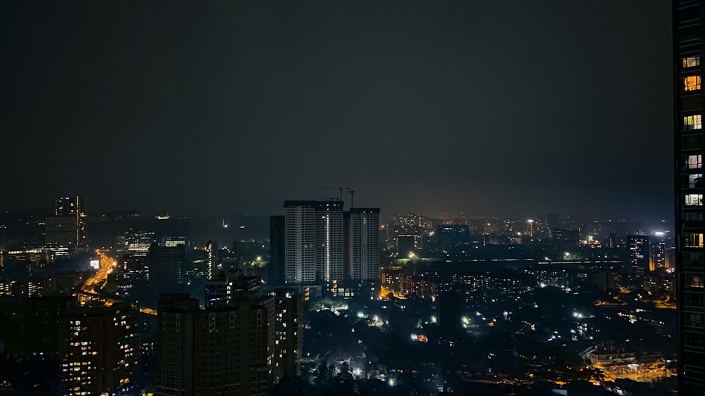 city with high rise buildings during night time