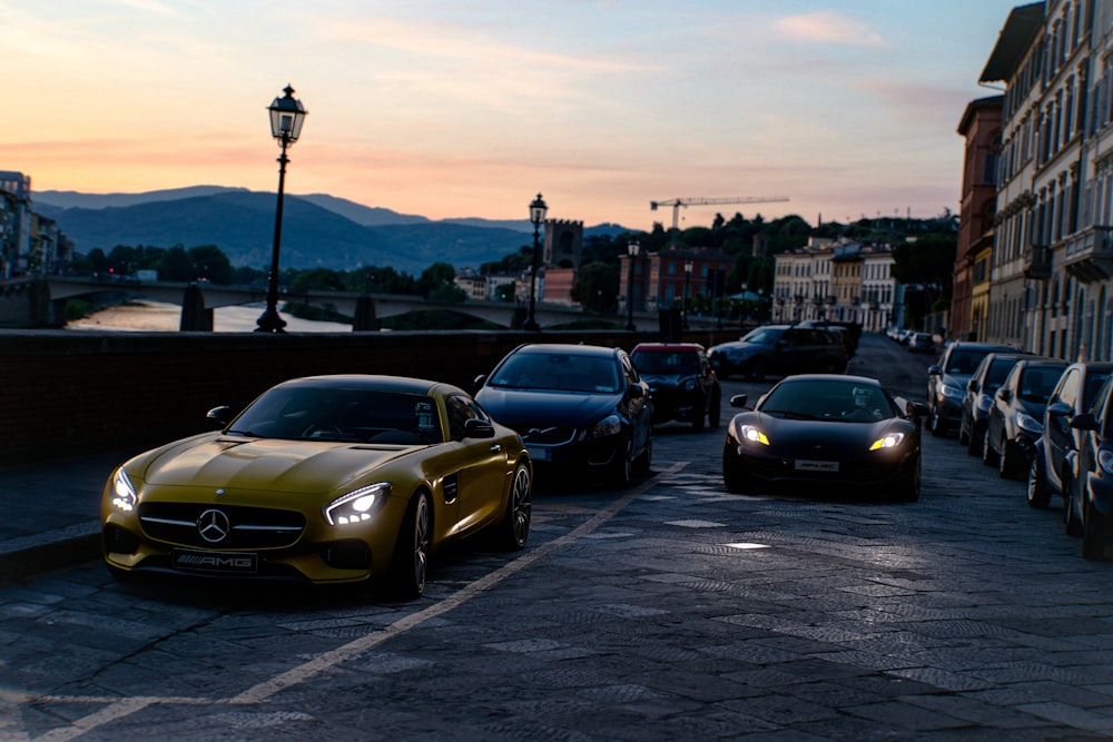 yellow porsche 911 on road during sunset