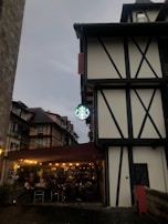 The charming exterior of Tattershall Castle Cafe, showing its quaint entrance on a sunny afternoon.