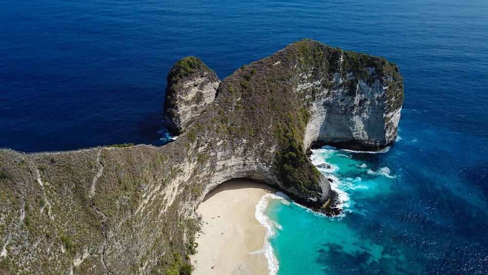 gray rock formation on seashore during daytime