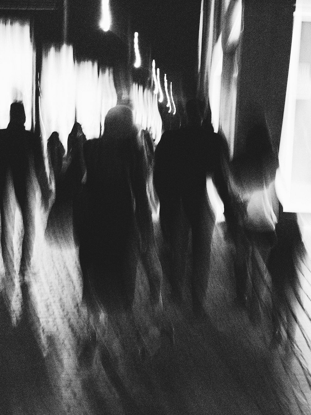 silhouette of people walking on the street