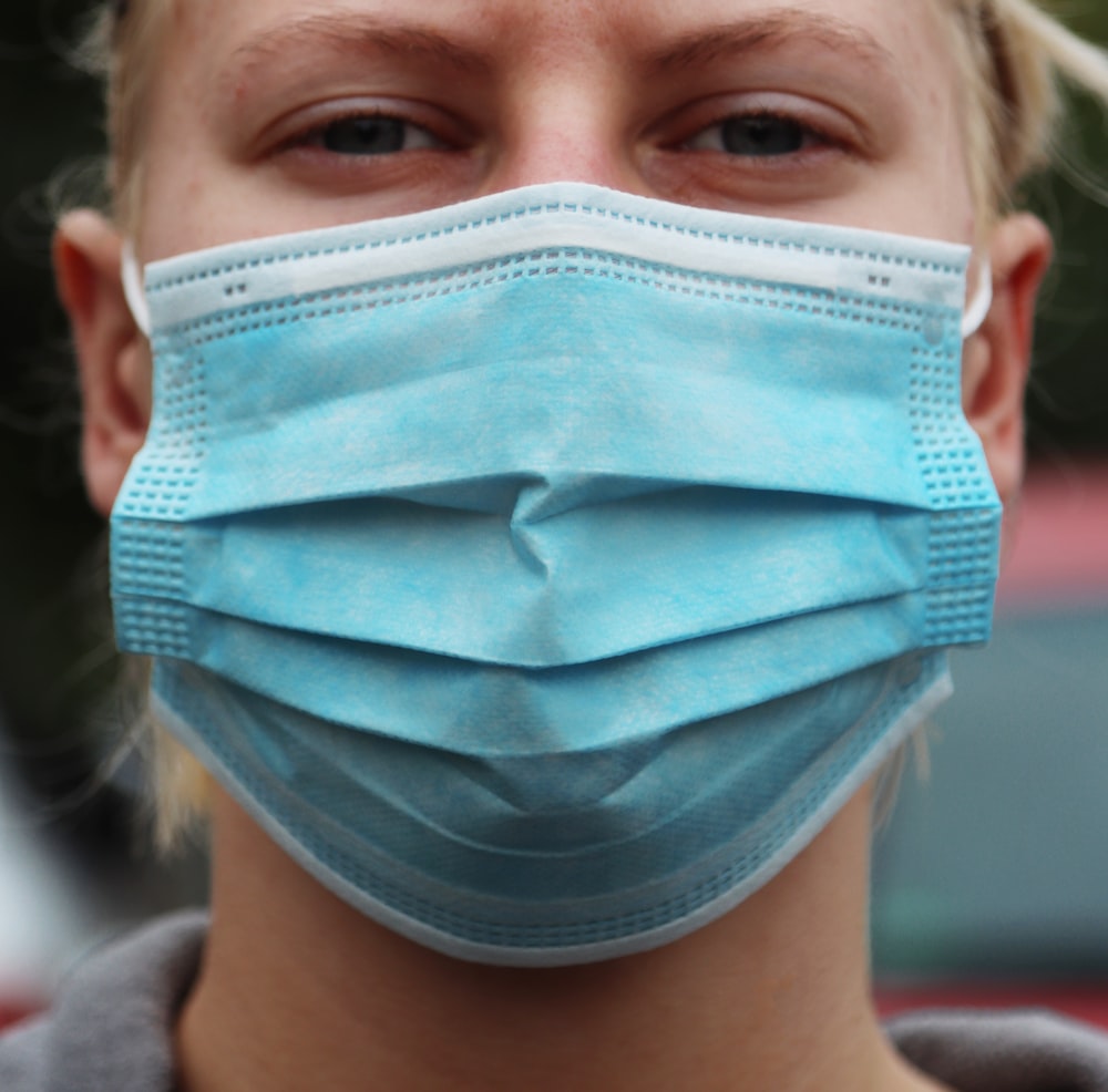 woman with blue face mask