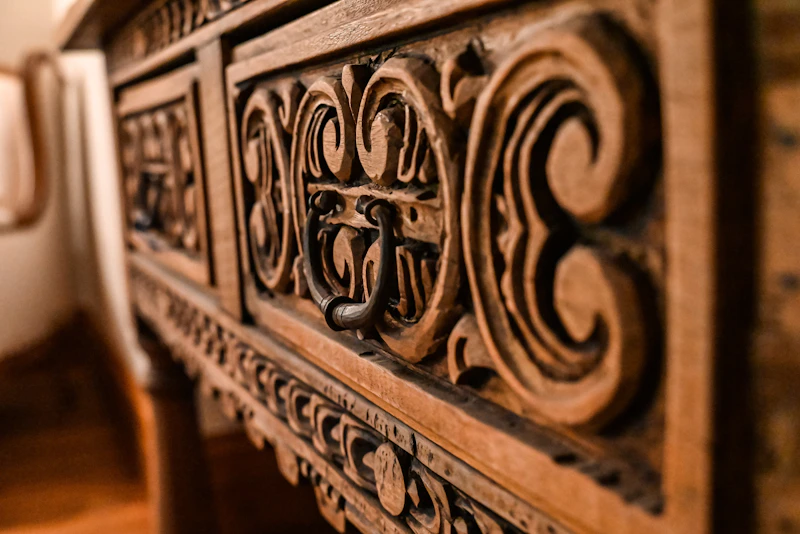 Oak desk with drawers and leather-inlaid writing surface in a home study