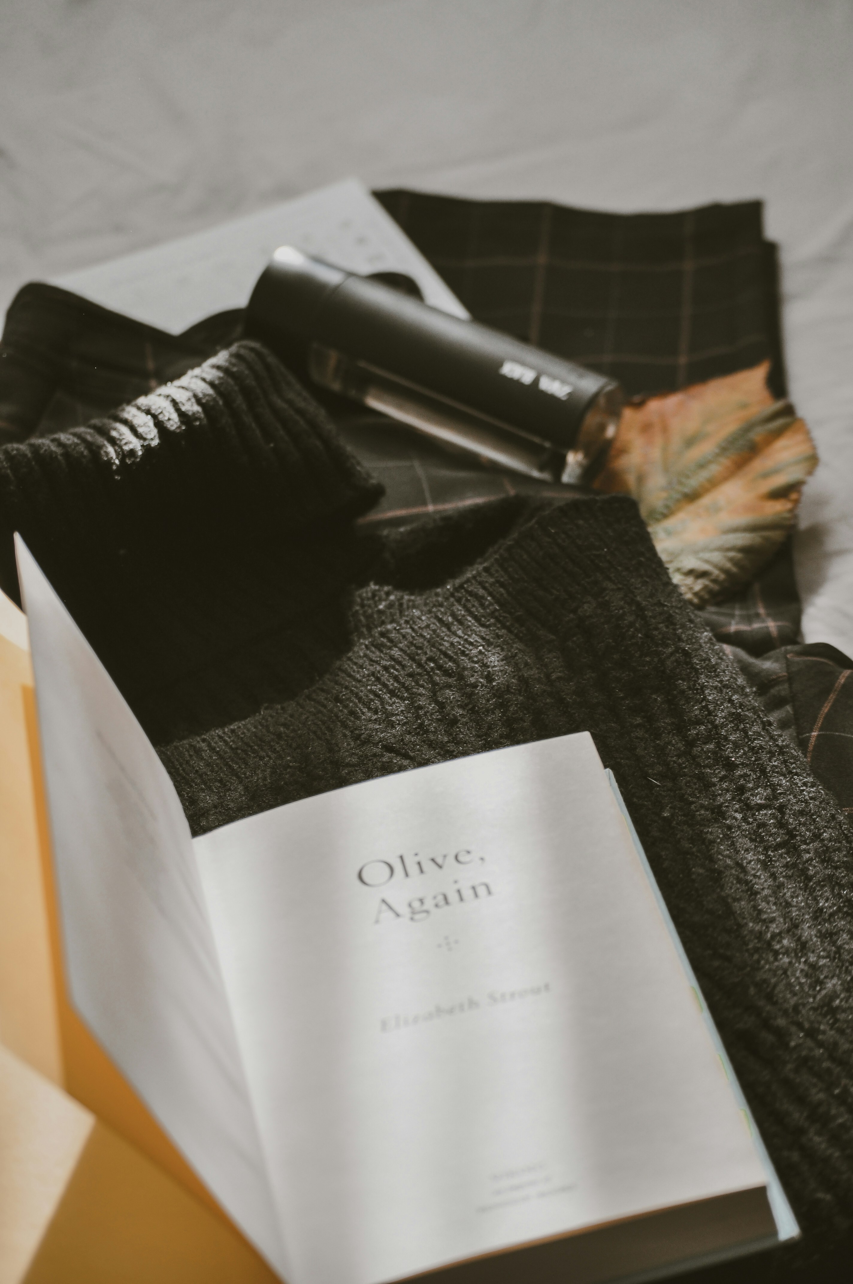 black and gray sock on white paper