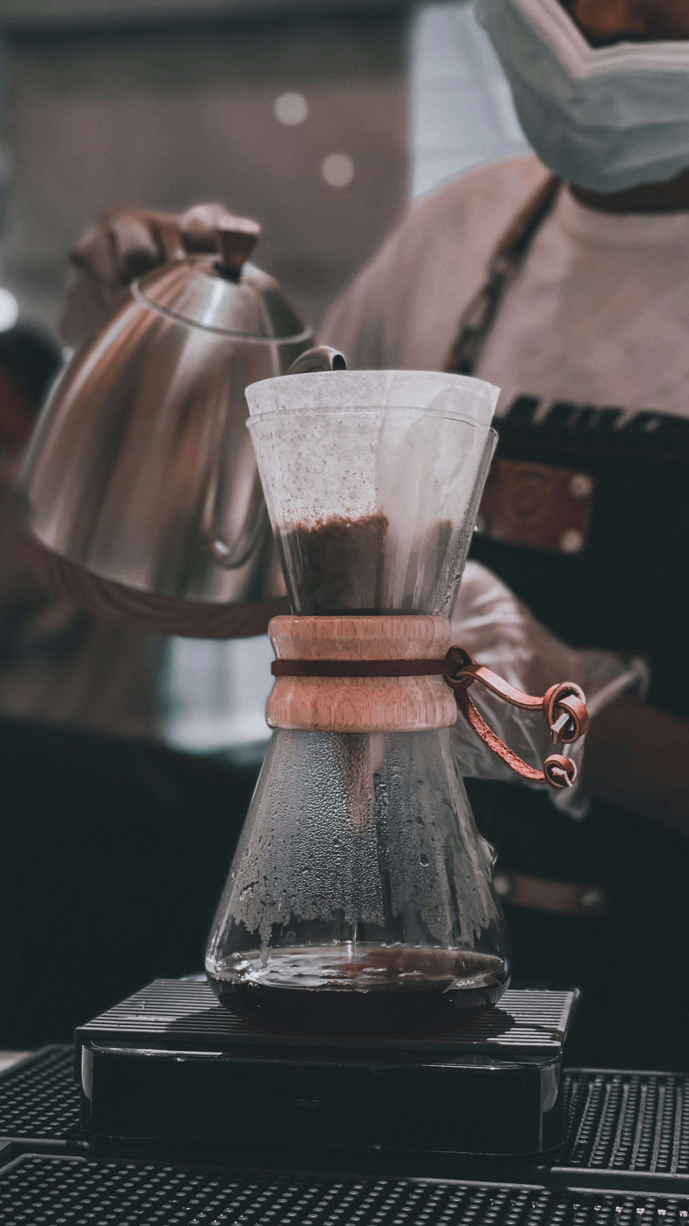 clear drinking glass on brown wooden stand