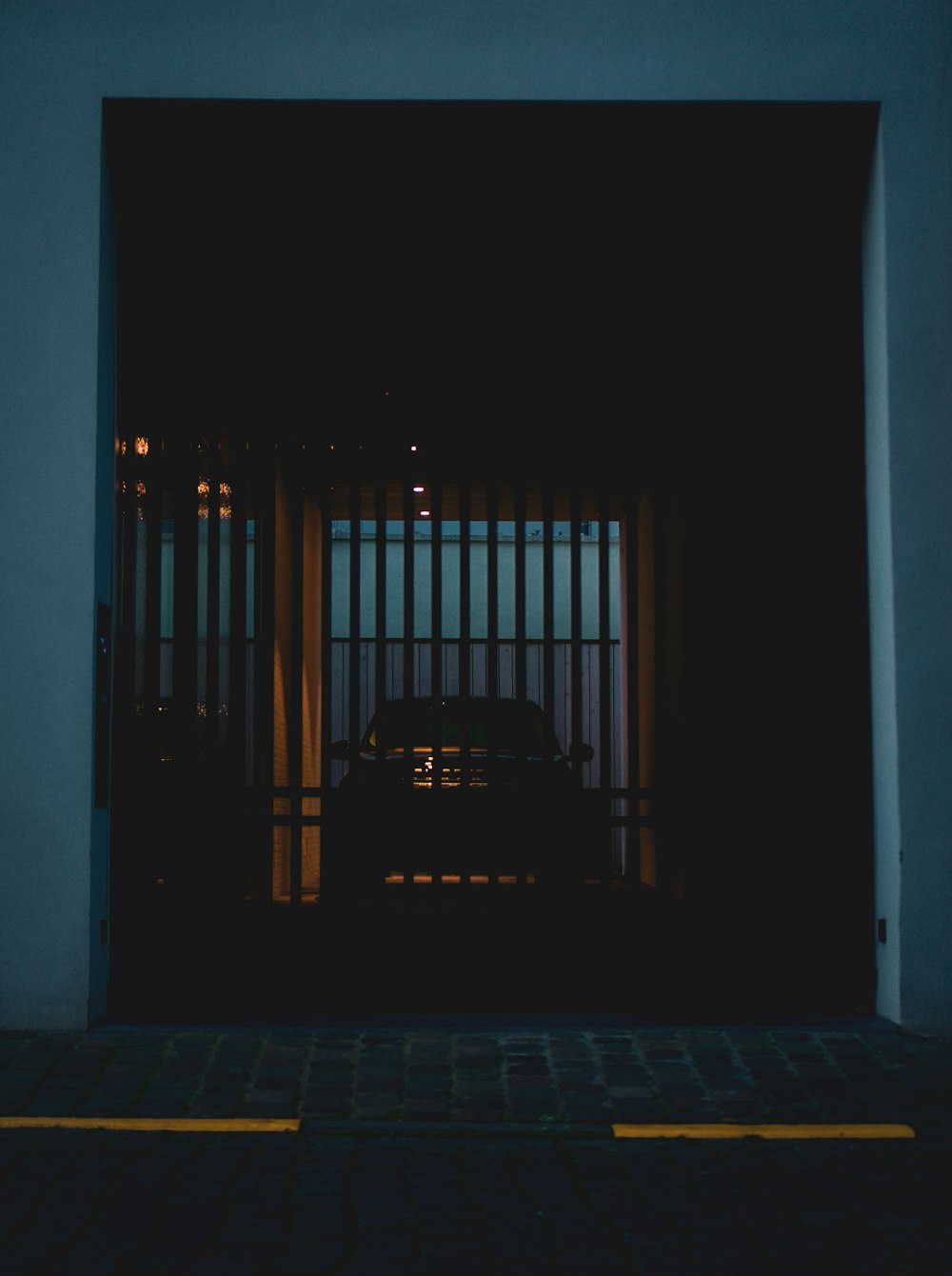 black metal gate during night time