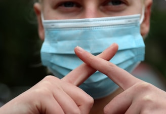 person holding blue and white plastic container
