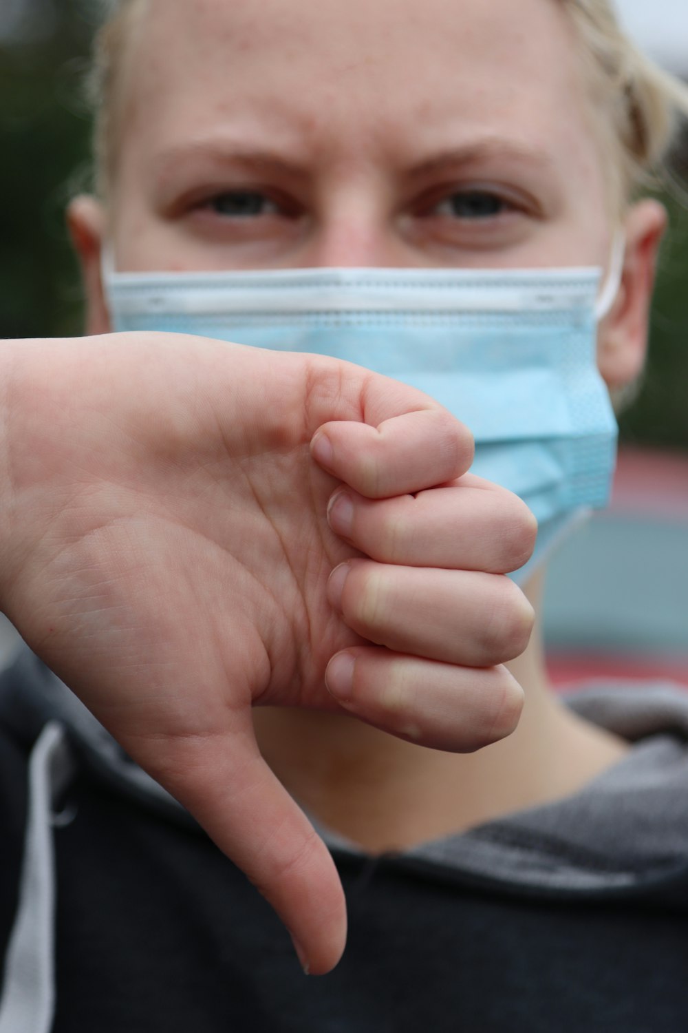 person holding clear plastic container