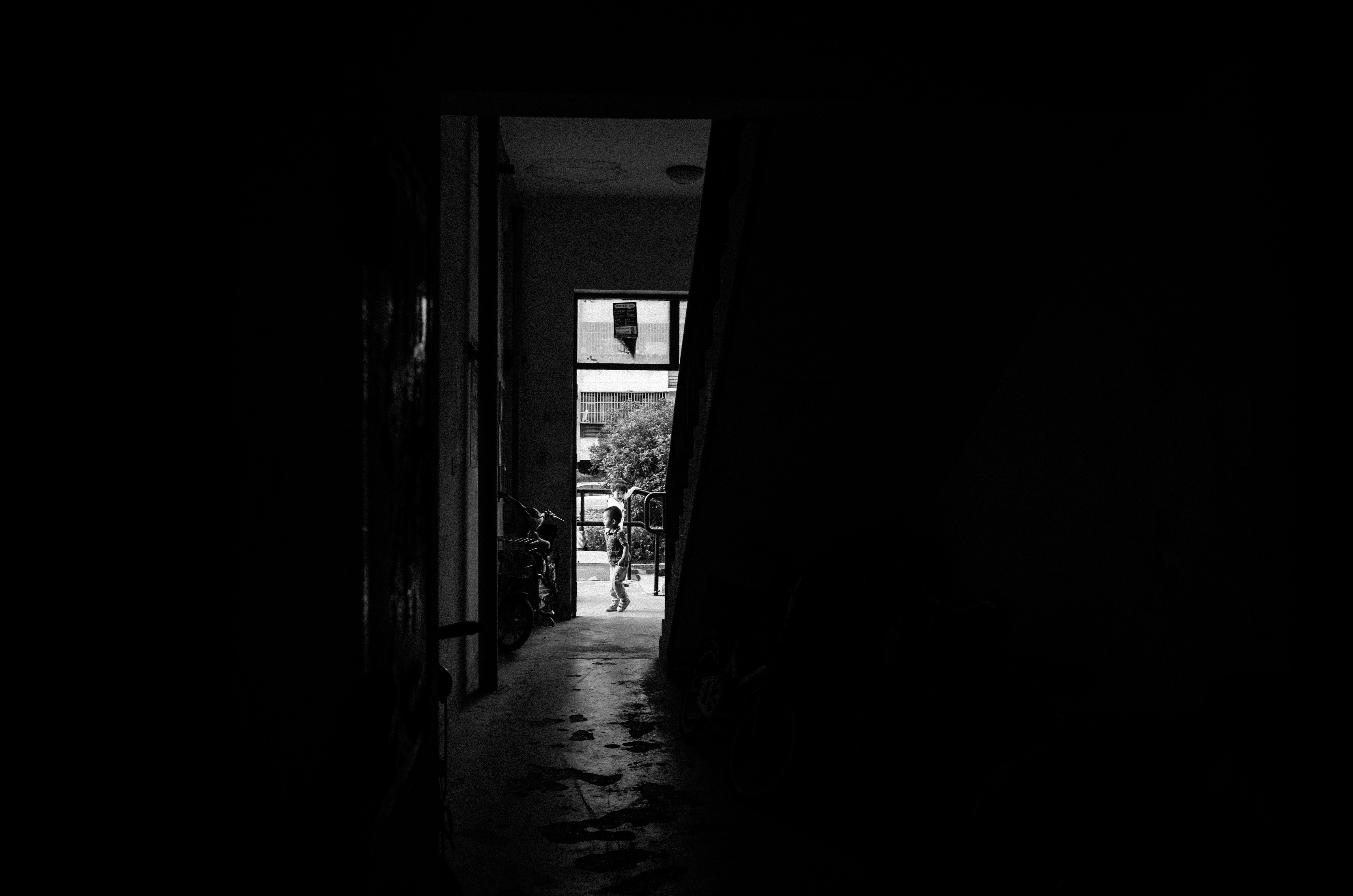 grayscale photo of hallway with no people