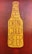 A graphic stylized as a beer bottle with the text 'Good People Drink Good Beer' written in bold, uppercase letters. The design features a mustard yellow bottle shape against a textured, dark reddish-brown background.