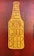 A graphic stylized as a beer bottle with the text 'Good People Drink Good Beer' written in bold, uppercase letters. The design features a mustard yellow bottle shape against a textured, dark reddish-brown background.