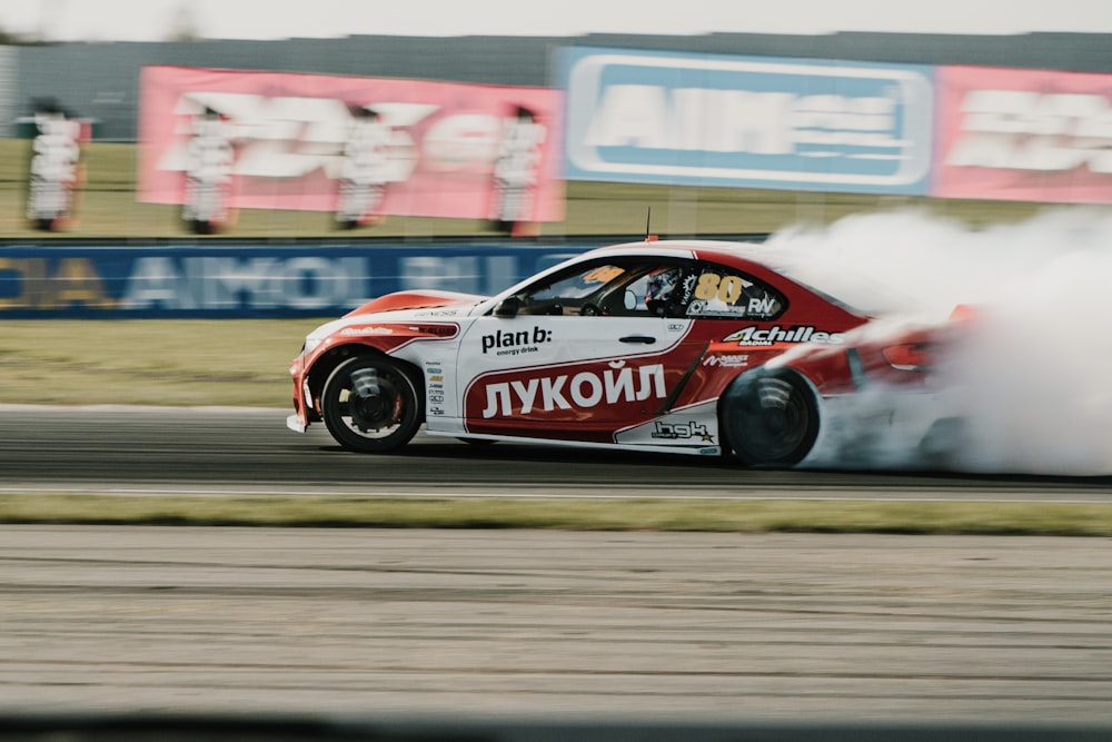 white and red porsche 911 on track