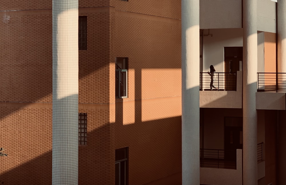 brown brick building with white wooden door