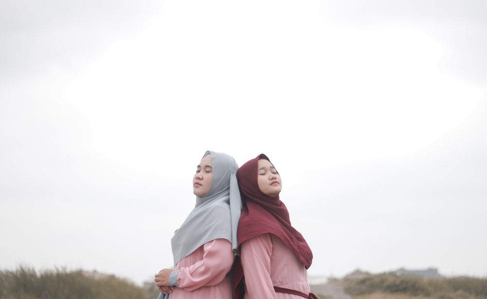 woman in gray hijab and pink coat