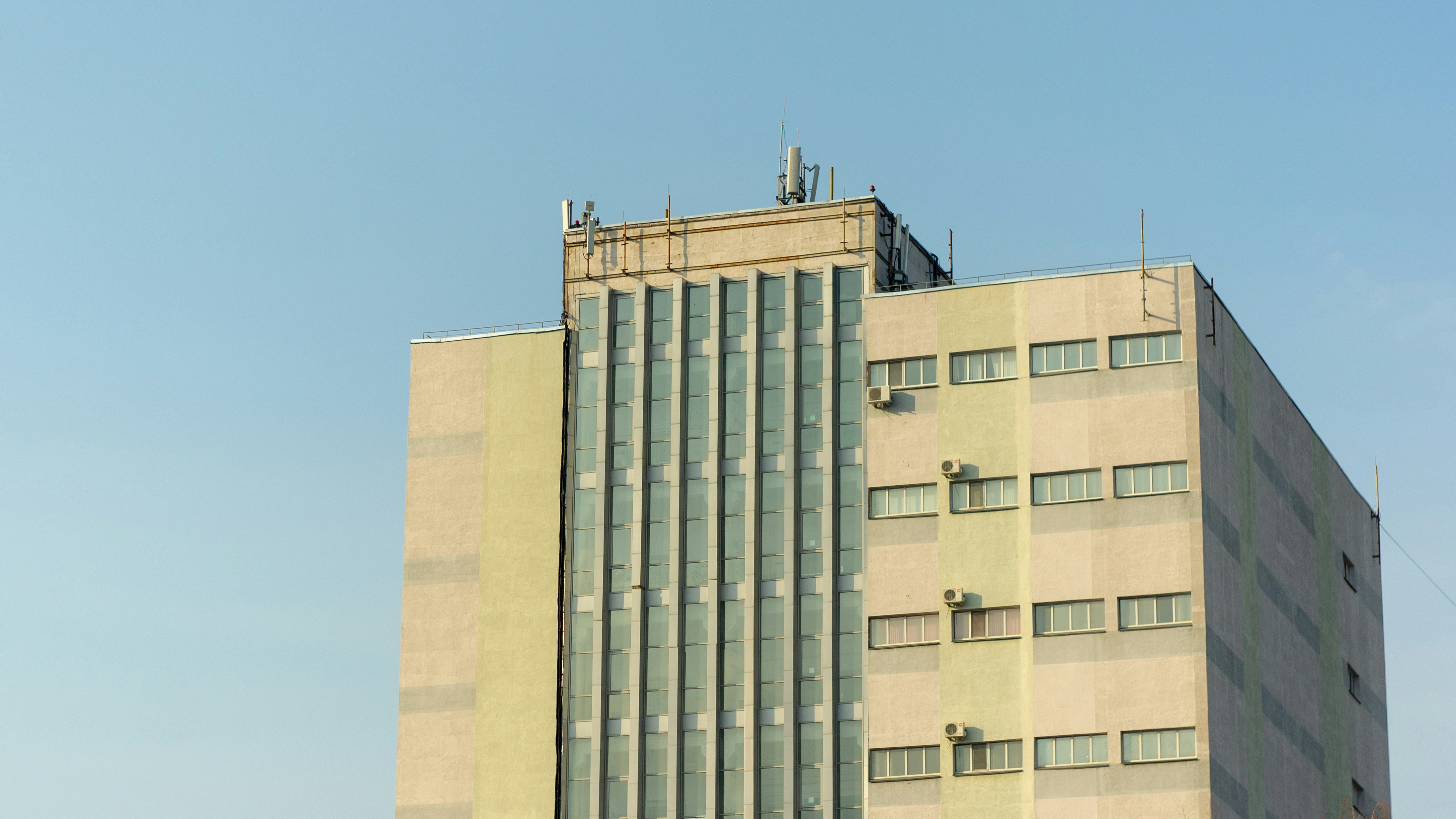 brown concrete building under blue sky during daytime