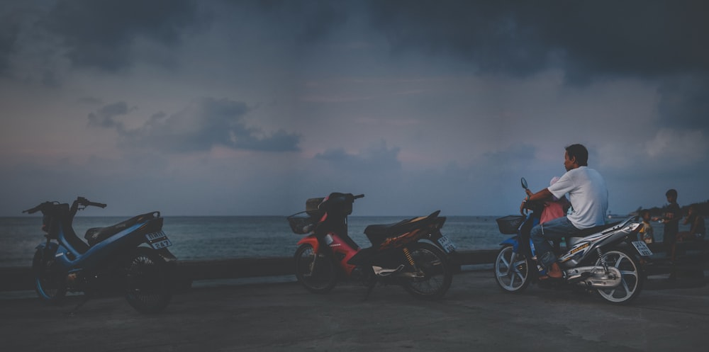 black and red motorcycle on beach during daytime