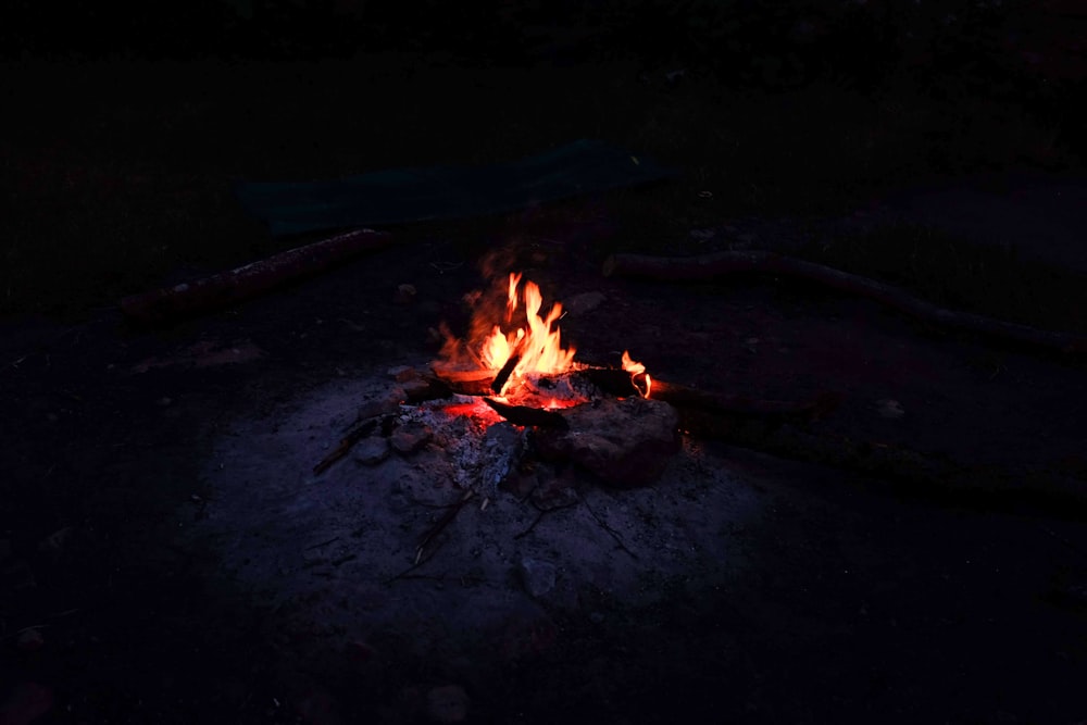 bonfire on black sand during night time