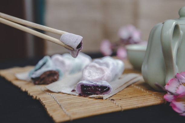 brown wooden chopsticks on brown wooden chopping board
