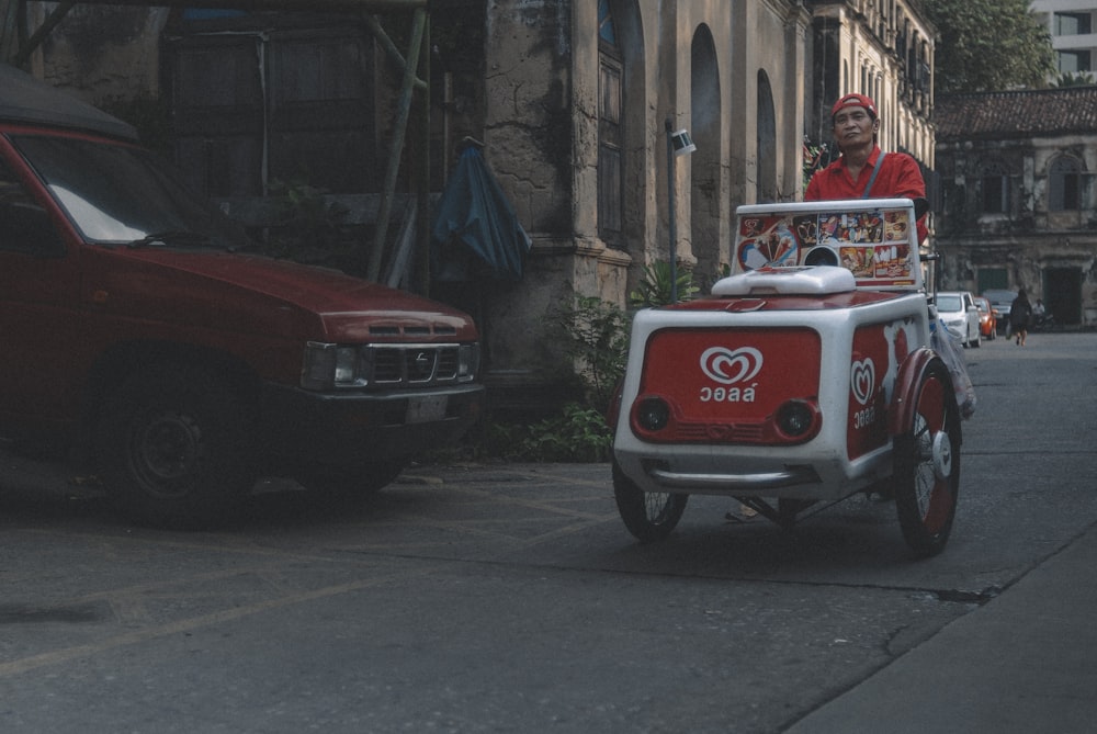 red and white car on road during daytime