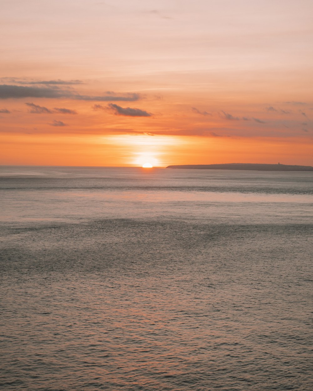 body of water during sunset