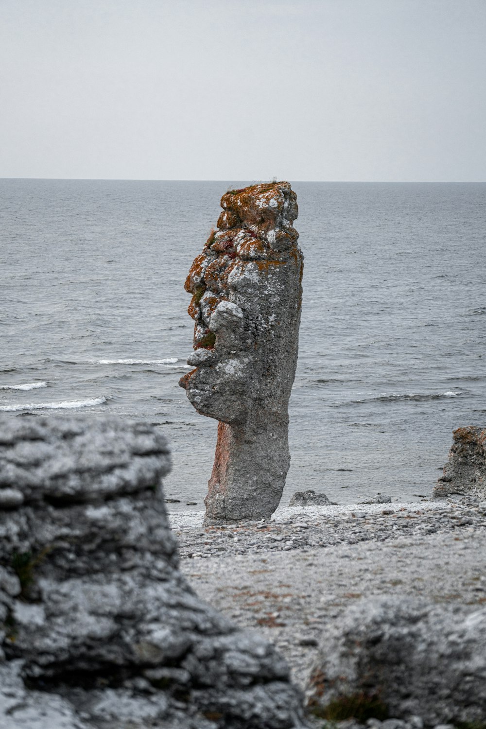 brown rock formation on sea during daytime