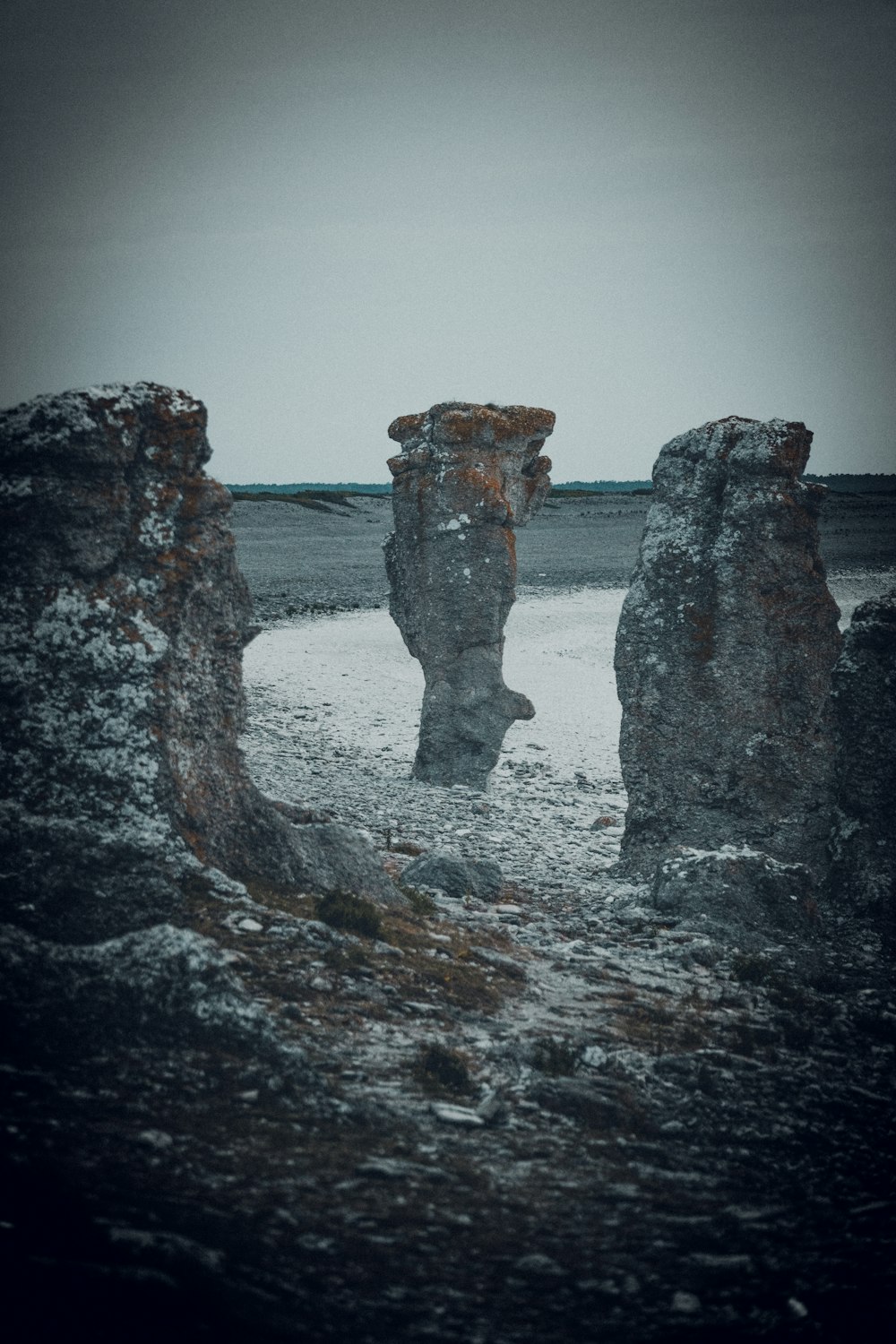 gray and brown rock formation on sea water