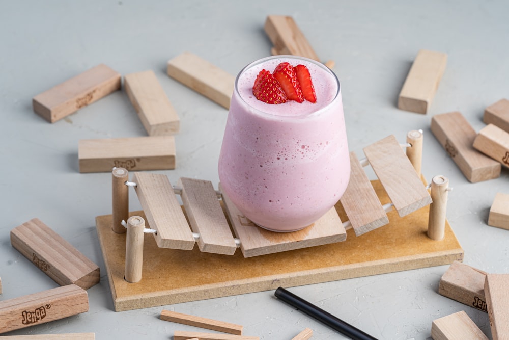 pink and white ice cream on white ceramic mug