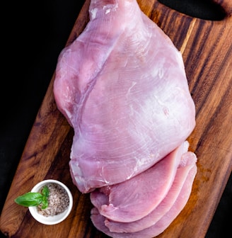 raw meat on brown wooden table