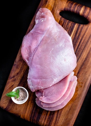 raw meat on brown wooden table