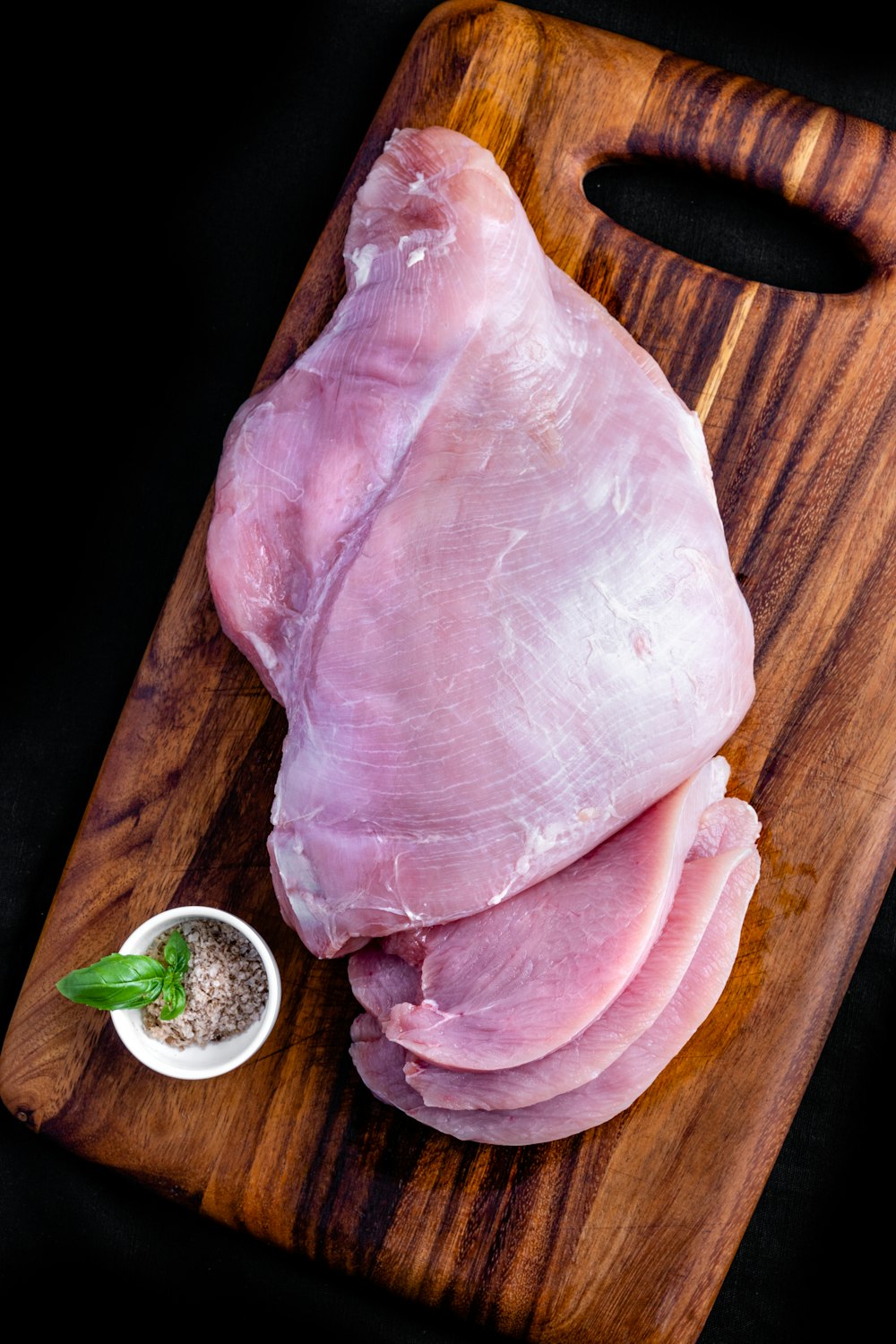 raw meat on brown wooden table