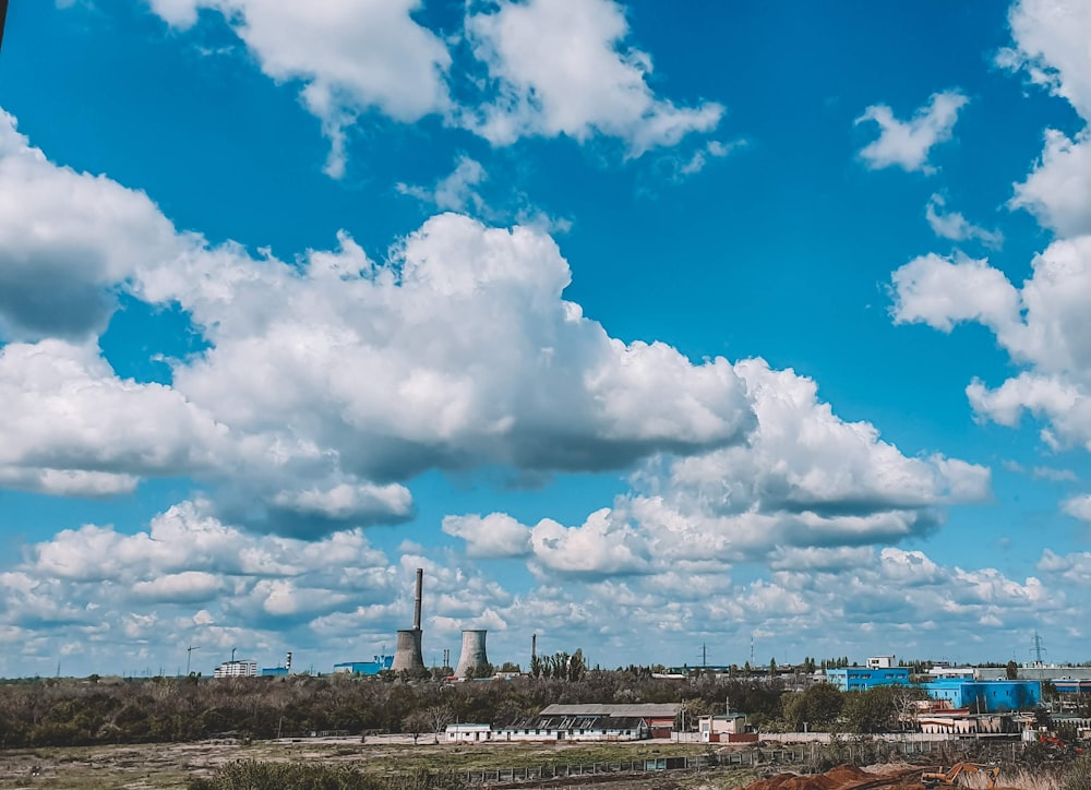 white clouds over city buildings during daytime