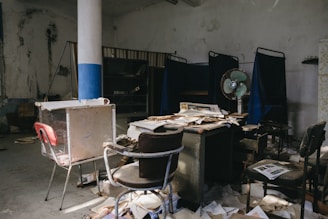 Restoration team drying out a water-damaged living room with industrial fans.