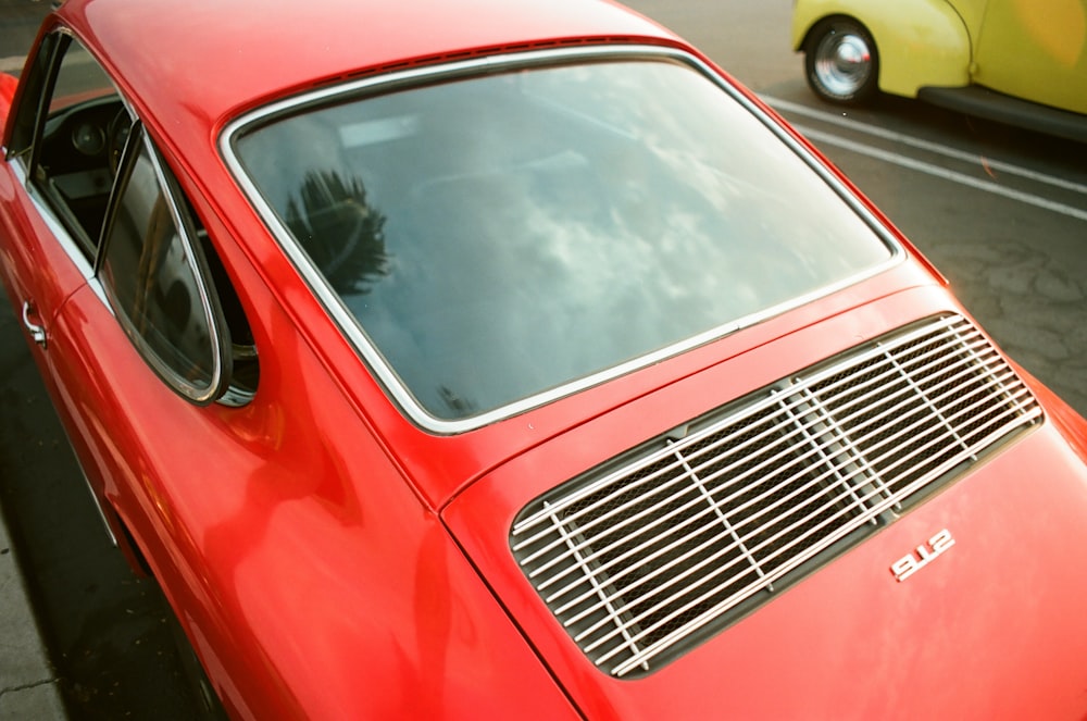 red car with white and black car in front