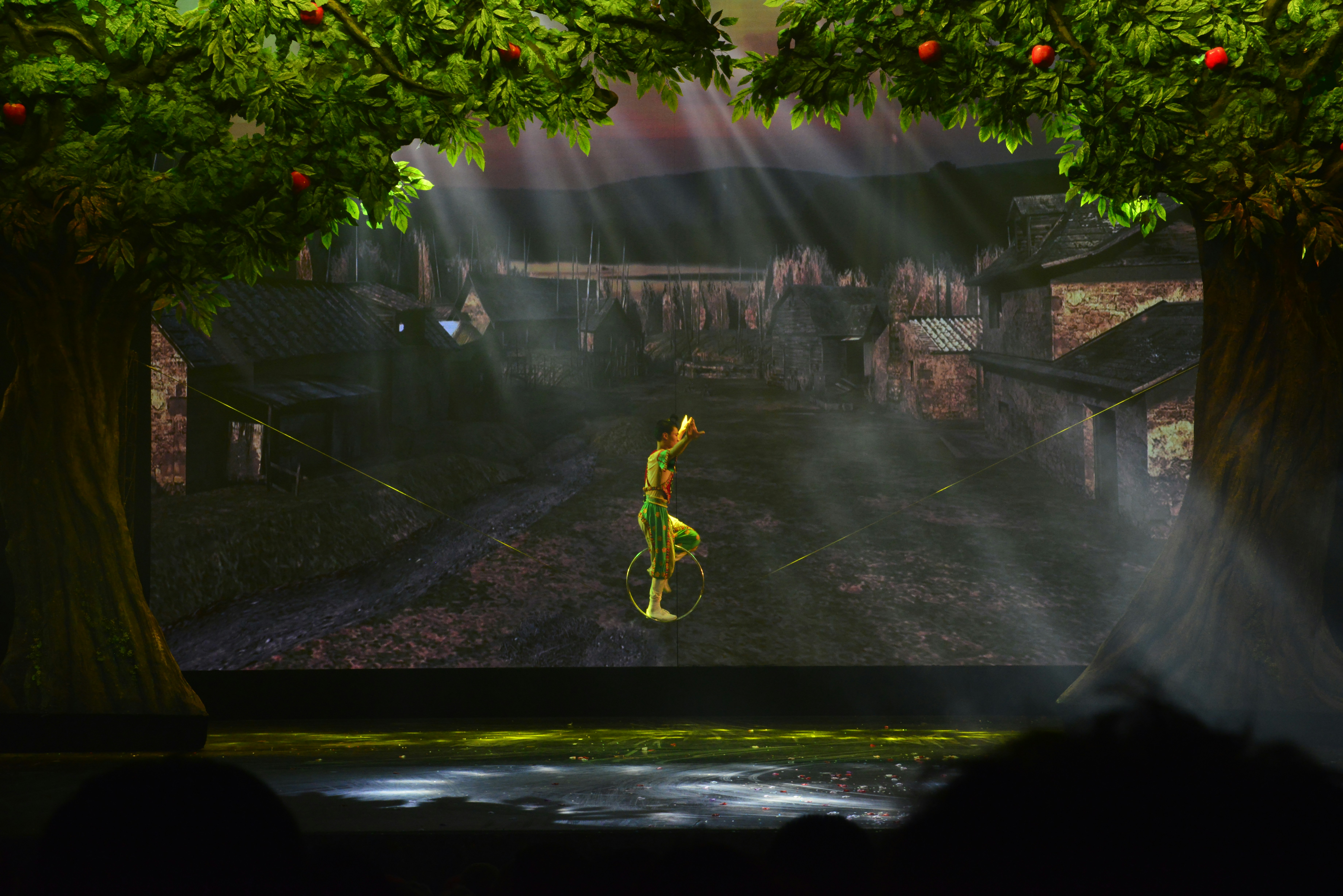 Bringing the World of Gielinor to the Screen — man in yellow shirt and black pants doing stunts on water fountain
