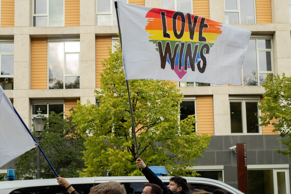 people holding flags during daytime