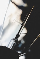 A hands-on view of delicate wiring work inside an antique lamp base.