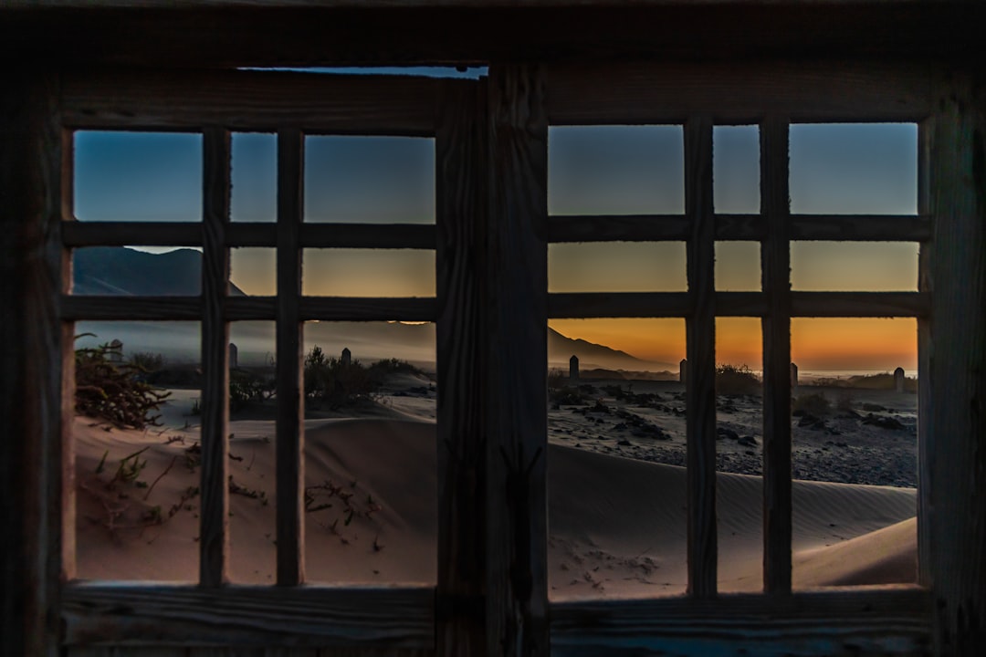 brown wooden framed glass window