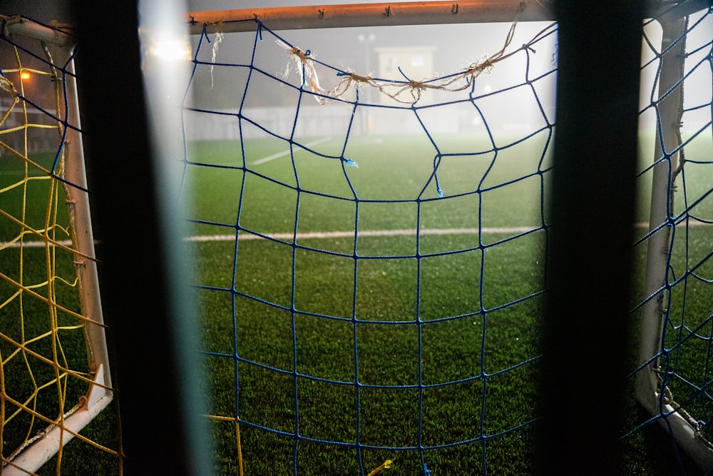 soccer goal net on green field