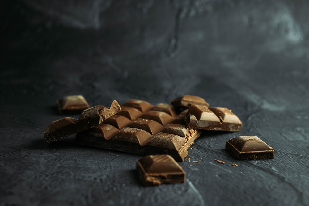 brown wooden blocks on black textile