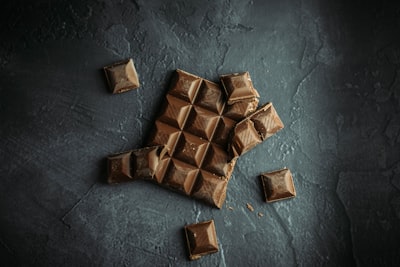 brown wooden blocks on gray concrete floor chocolate teams background