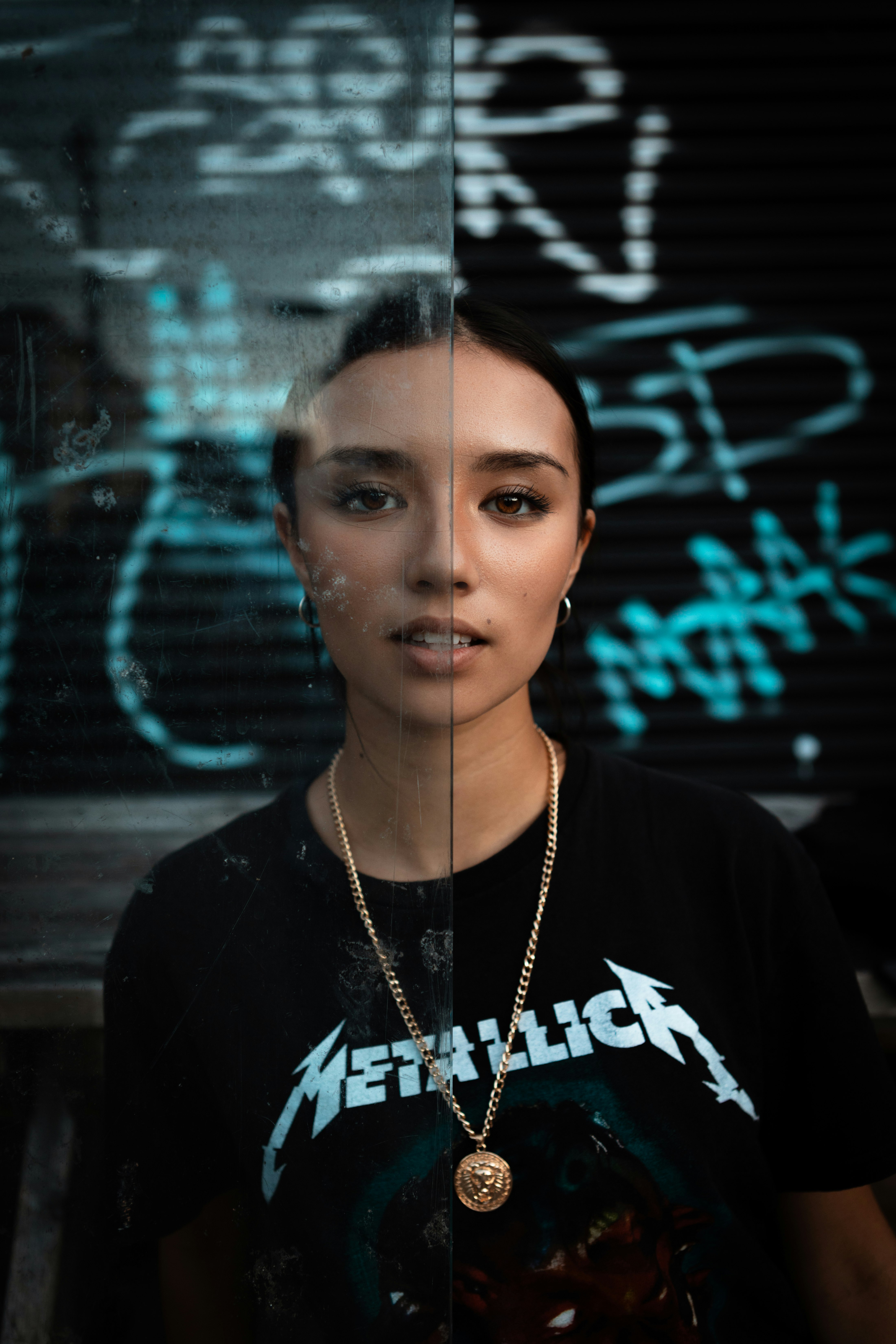 woman in black crew neck shirt wearing silver necklace