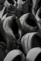 An overhead shot of various shoe styles laid out on a textured surface.