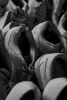 An overhead shot of a variety of premium pre-loved shoes, emphasizing texture and detail.