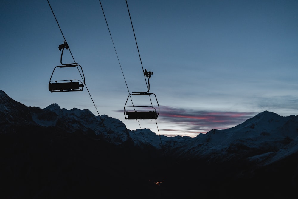 cable car over the mountains during daytime